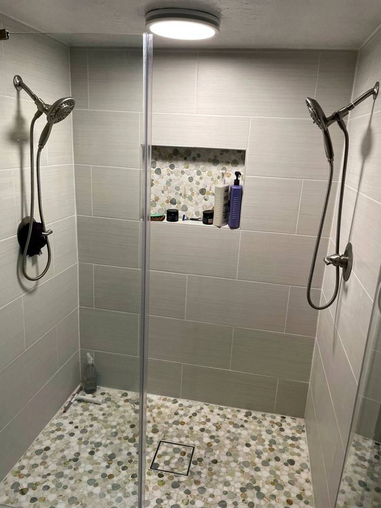 Walk-in shower, dual heads, pebble floor